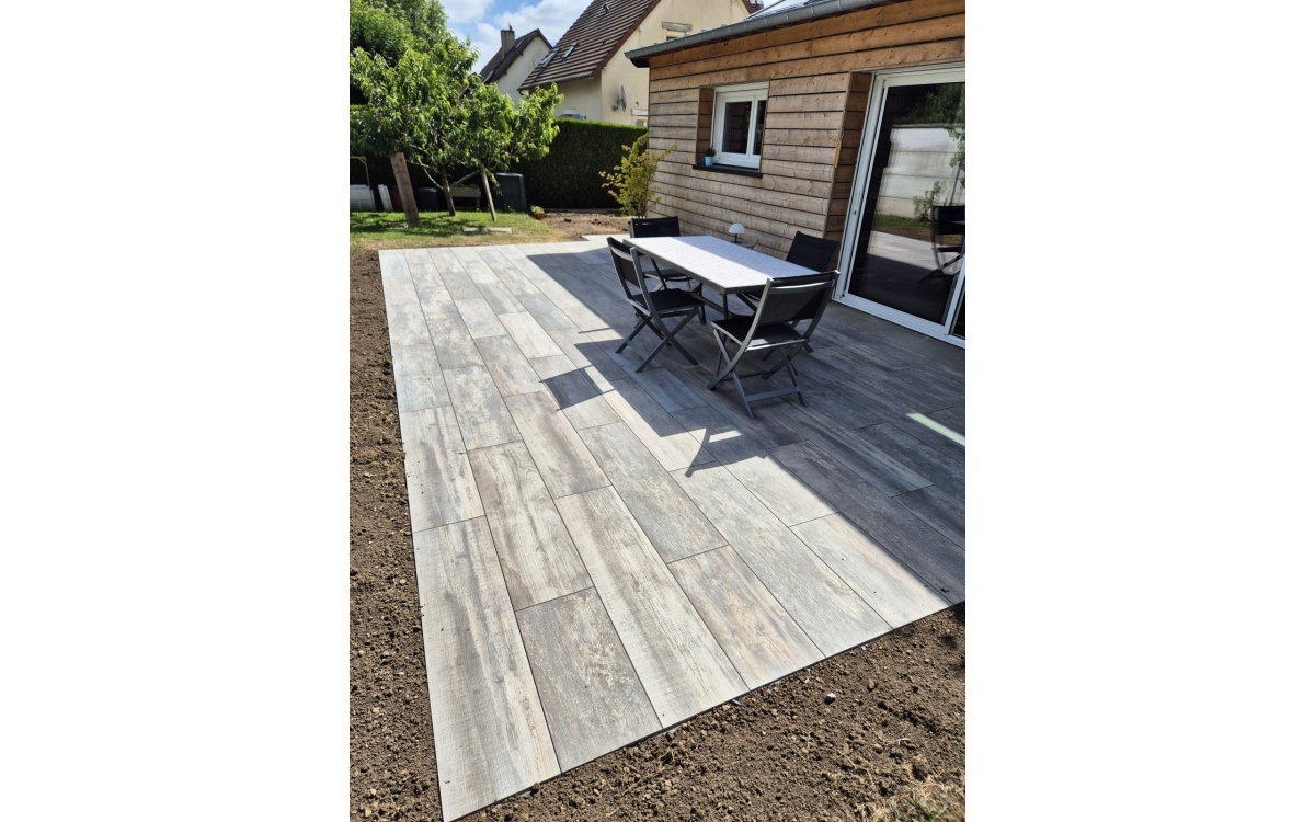 Ralisation Terrasse en dallage sur plots  Bretteville-sur-Odon  conue le 01/07/2024